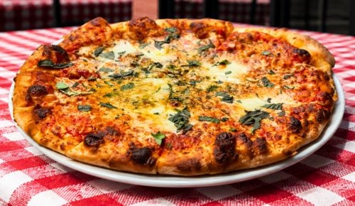 Authentic thin-style Margherita pizza with bocconcini and basil